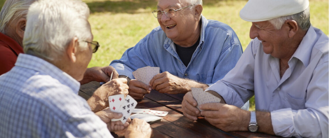 old people playing cards