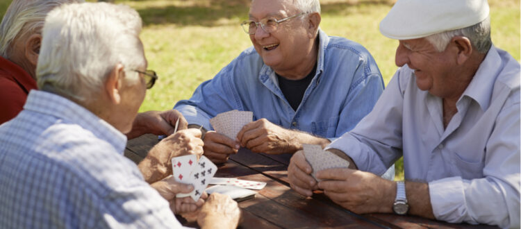 old people playing cards