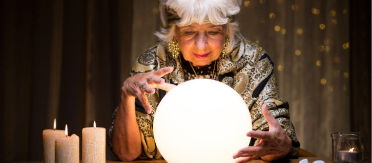 woman looking into a crystal ball